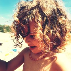 Close-up portrait of girl at beach