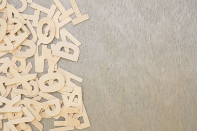 Directly above shot of letters on wooden table