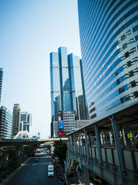 Modern buildings in city against clear sky