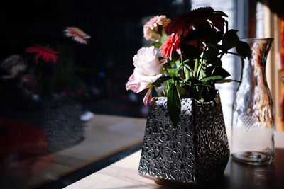 Close-up of flower vase on table