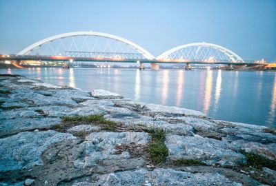 Bridge over water against clear sky