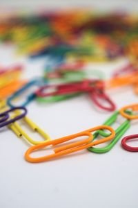 Close-up of colored pencils over white background