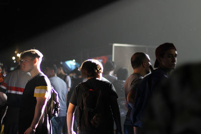 Rear view of people enjoying at music concert