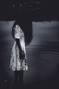 Woman standing on beach