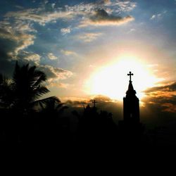 Silhouette of built structure at sunset