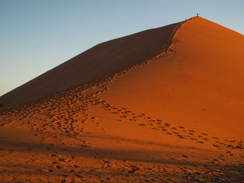 Scenic view of desert against clear sky