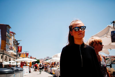 Woman standing in front of building