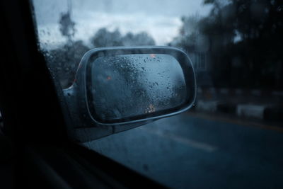 Reflection of car on side-view mirror