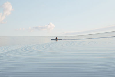 Digital composite man kayaking