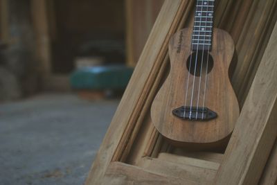 Close-up of guitar on frame