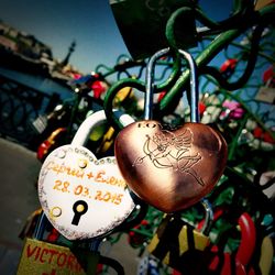 Close up of padlocks hanging on string