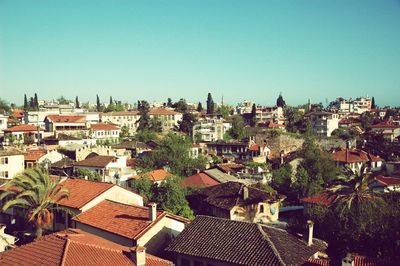 High angle view of townscape against clear blue sky