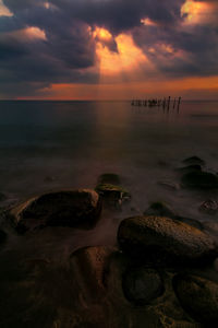 Scenic view of sea against cloudy sky