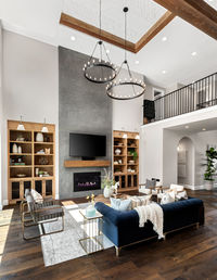 Living room in new luxury home with floor to ceiling fireplace