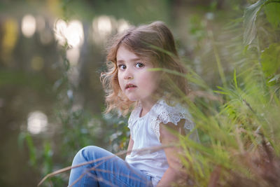 Portrait of young woman looking away