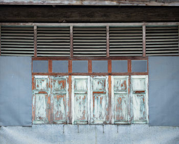 Abandoned building against wall