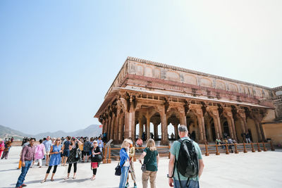 Group of people in front of historical building