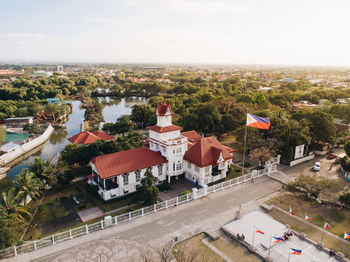 High angle view of buildings in town against sky