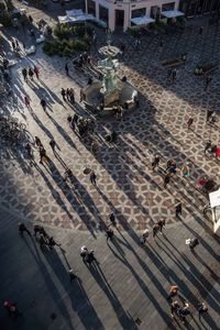 High angle view of people walking in city