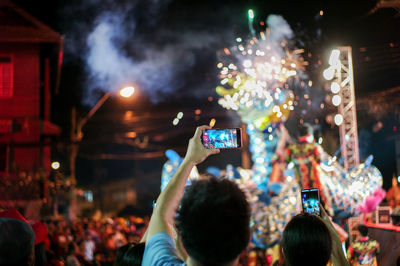 People photographing at night