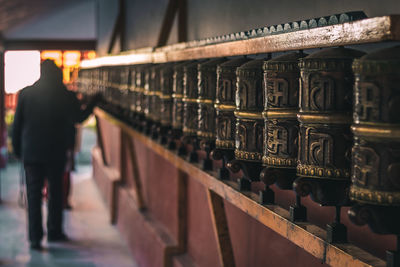 Close-up of people standing in row of building