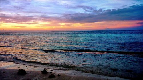 Scenic view of sea against dramatic sky