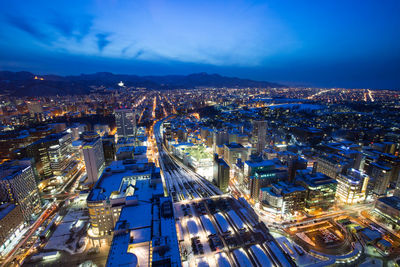 Arial view of illuminated city at night