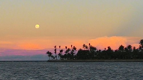 Scenic view of sea at sunset