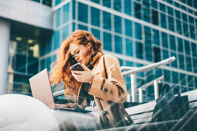 Young woman using mobile phone