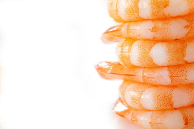 Close-up of coffee beans against white background