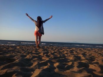 Woman standing on beach