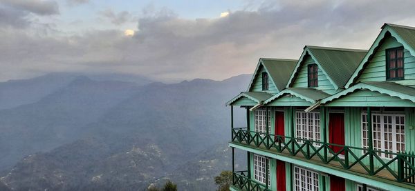 House by building against sky