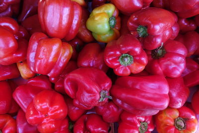 Full frame shot of red bell peppers at market stall