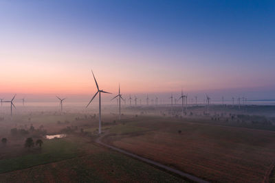 Scenic view of field against sky during sunset