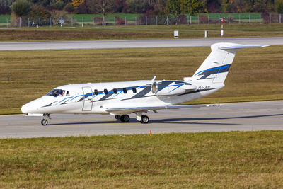 Side view of airplane on runway