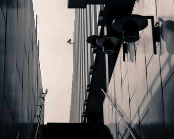 Low angle view of street light against building