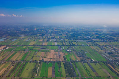 Aerial view of agricultural field against sky