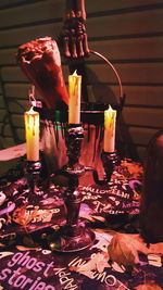 Close-up of candles on table