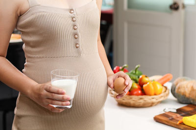 Midsection of woman preparing food