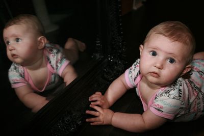 Portrait of cute baby girl at home