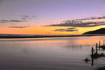 Scenic view of lake against sky during sunset