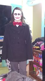 Portrait of happy young woman standing in store