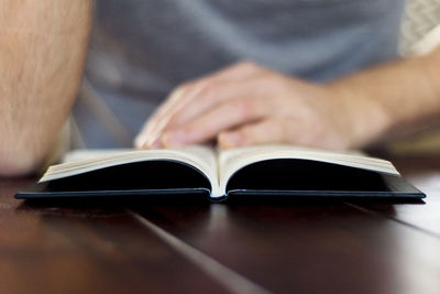 Close-up of hand holding book