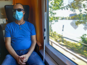 Man sitting in train