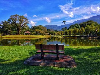 Gazebo by lake against sky