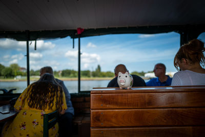 Portrait of people sitting on table