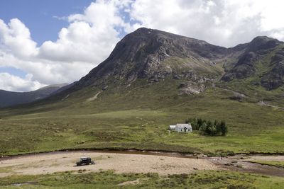 Scenic view of landscape and mountains against sky