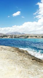 Scenic view of sea against blue sky