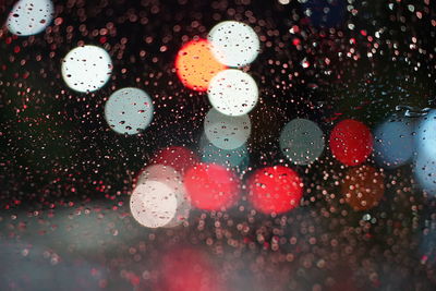 Full frame shot of wet glass window bokeh in rainy season 