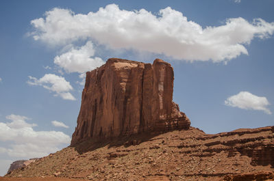 Low angle view of rock formation against sky